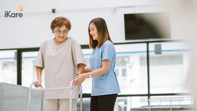 Senior patient with walking frame and nurse