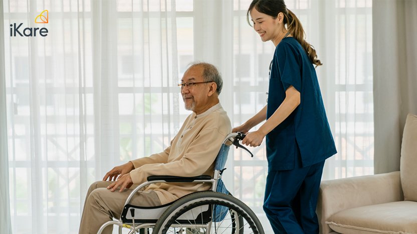 Older Patient on Wheelchair with Female Nurse
