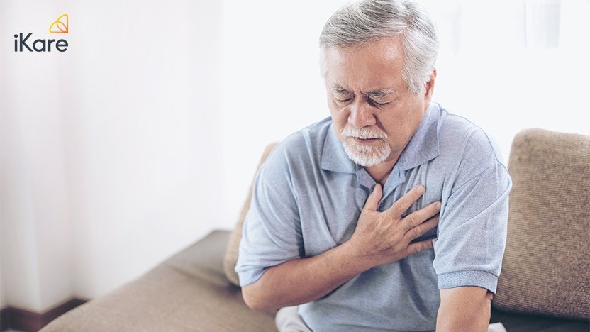 Old Man Having Heart Attack and Grabbing her Chest