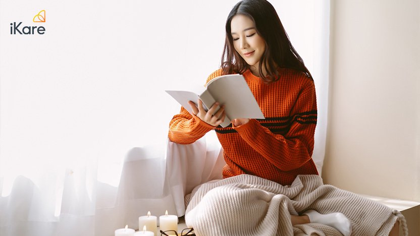 Woman Wearing Knitted Sweater Relaxing Reading Book